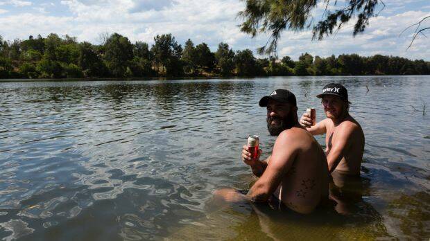 Friends cool off in the Nepean River in Penrith on Sunday.  Photo: Brook Mitchell