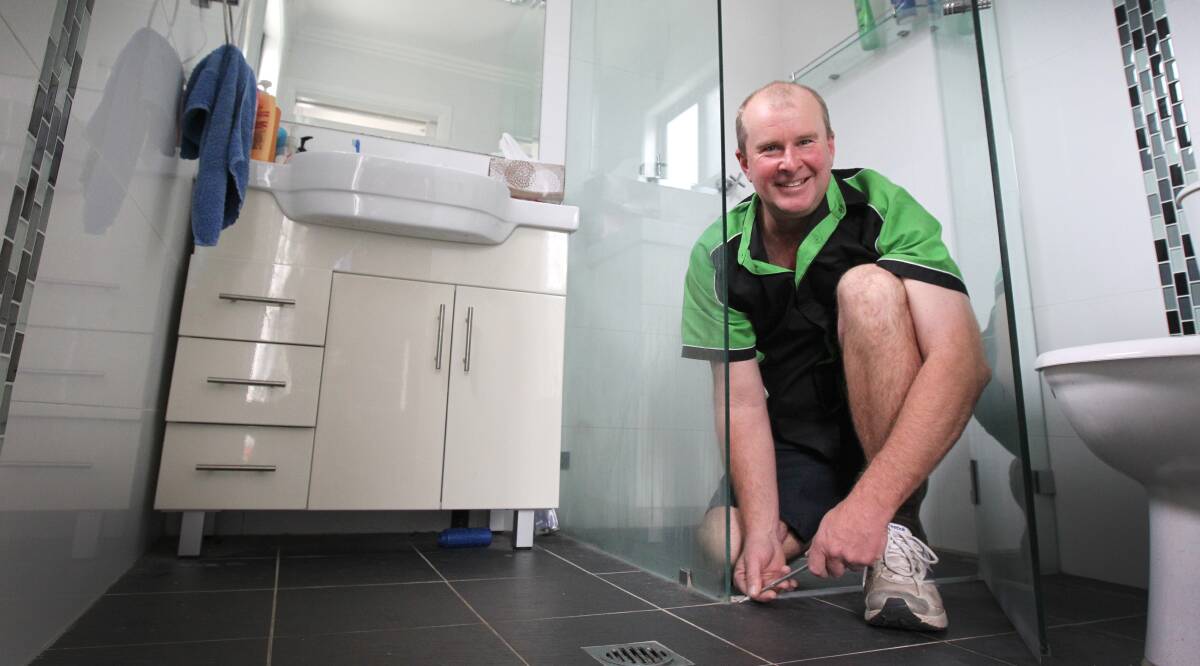 Like new: Tile Regrouting owner and licensed tradesman, Andrew Marsh can help you refresh the bathroom with a simple tile makeover.
