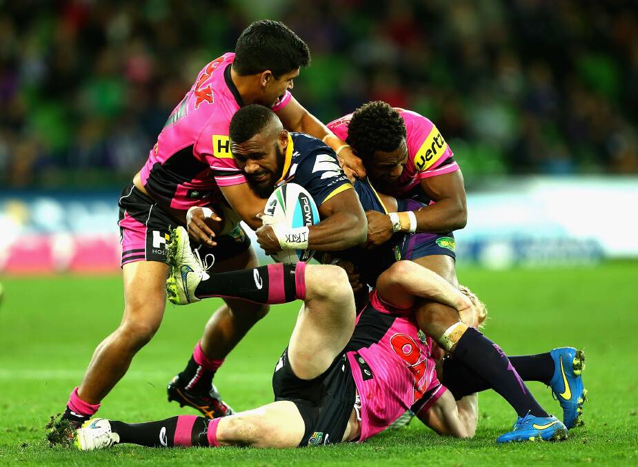 MELBOURNE, AUSTRALIA - JULY 17:  Marika Koroibete of the Storm is tackled during the round 19 NRL match between the Melbourne Storm and the Penrith Panthers at AAMI Park on July 17, 2015 in Melbourne, Australia.  (Photo by Robert Prezioso/Getty Images)