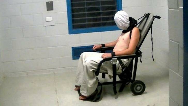 Dylan Voller is strapped to a chair wearing a spit hood, in an image from Four Corners. Photo: ABC