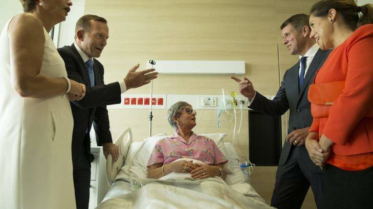 Mike Baird, right, with his wife Kerryn and Tony Abbott, left, with his wife Margie visit breast cancer patient Lyn Marvey at the Chris O'Brien Lifehouse Hospital in February. Photo: Nic Walker