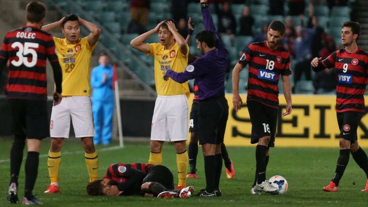 Disbelief: Guangzhou Evergrande react to one of the red cards. Photo: Brendan Esposito
