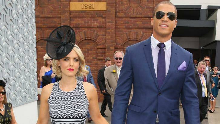 High profile: Louise Pillidge and Blake Garvey make their first official appearance as a couple at the 2014 Melbourne Cup.  Photo: Scott Barbour