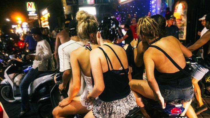 Australian schoolies live it up in Bali’s party street, Jalan Legian. Other schoolies, not pictured, say they are still taking magic mushrooms. Photo: Nic Walker