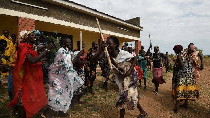 Women supporters of the opposition dance at the opposition's base camp on the outskirsts of Juba. Photo: Kate Geraghty