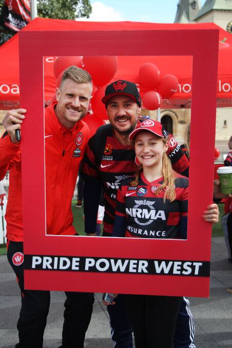 Team pride: Andrew Redmayne meets Wanderers fan Darren Celebrin and daughter Yasmin. Picture: Sam Venn 