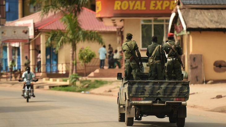 South Sudanese goverment soldiers drive through the streets of Juba, as the nation awaits the return of opposition leader and vice-president-designate Riek Machar.  Photo: Kate Geraghty