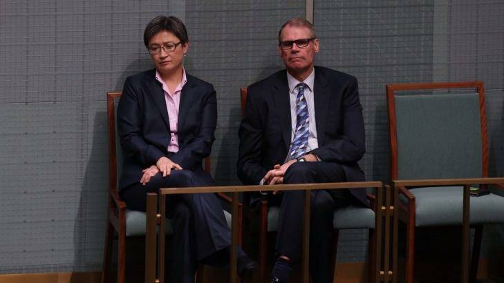 Labor senators Penny Wong and John Faulkner listen to MPs pay tribute to Mr Whitlam in the House of Representatives. Photo: Andrew Meares