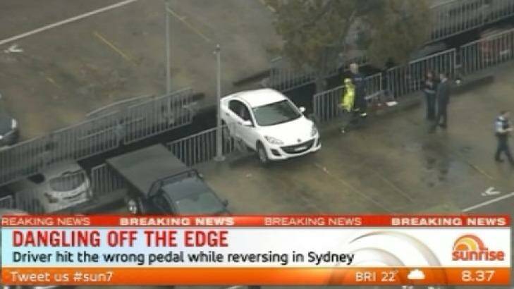 Precarious: The driver was freed without injury. Photo: Channel Seven