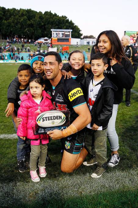 SYDNEY, AUSTRALIA - JULY 06:  Brent Kite of the Panthers poses with family after receiving a commemorative football in acknowledgement of three hundred NRL games during the round 17 NRL match between the Wests Tigers and the Penrith Panthers at Leichhardt Oval on July 6, 2014 in Sydney, Australia.  (Photo by Brendon Thorne/Getty Images)