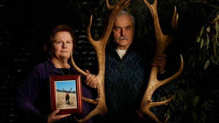 Narelle and Manfred Wagner show off Karl's antlers from last year and hold newly developed photographs of the deer. Photo: Mark Jesser