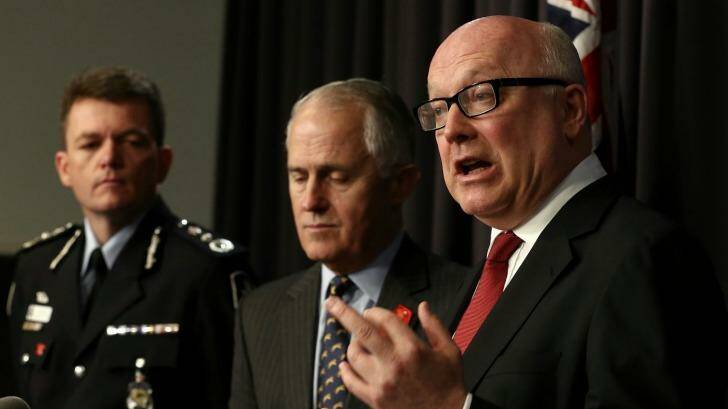 AFP Commissioner Andrew Colvin, former communications minister Malcolm Turnbull, Attorney-General George Brandis. Photo: Alex Ellinghausen
