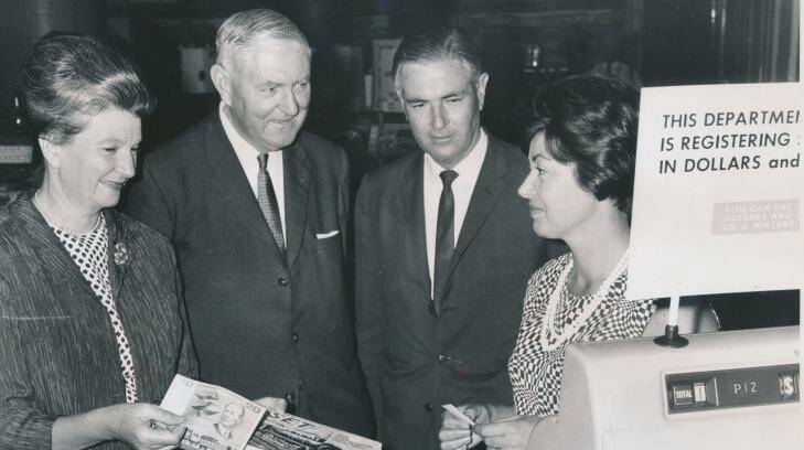 A smooth transition: Miss N. Malseed (in charge of decimal training at Myer), Sir Walter Scott, Mr L. B. Brand and Mrs J. Smith, Myer staff member.  Photo: R. Wheeler