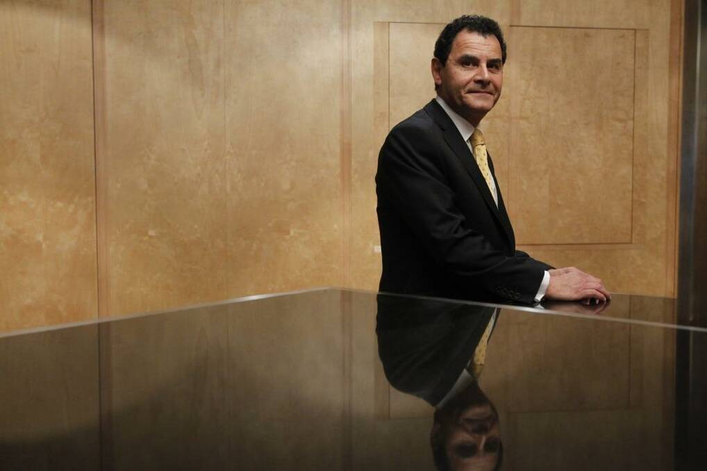 Sitting pretty: Medibank CEO George Savvides will get a $750,000 bonus for successfully completing the company's IPO. Photo: Louise Kennerley
