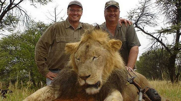Hunter Walter James Palmer, left, with another lion he killed. Photo: Facebook