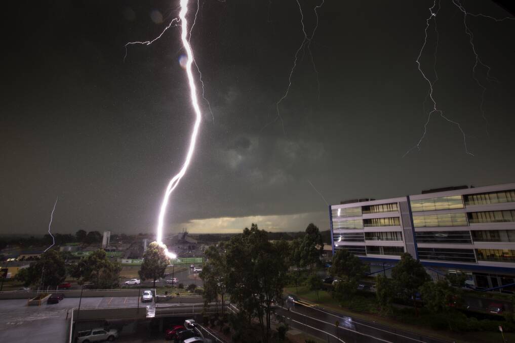 Thunderstruck: Lightning strike captured from Bella Vista as a thunderstorm rolled across western Sydney in December 2014. Picture: Geoff Jones