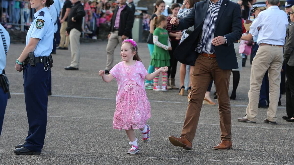 Ellie Girdler skips off after meeting the Prince and Princess. Pic: Anthony Johnson