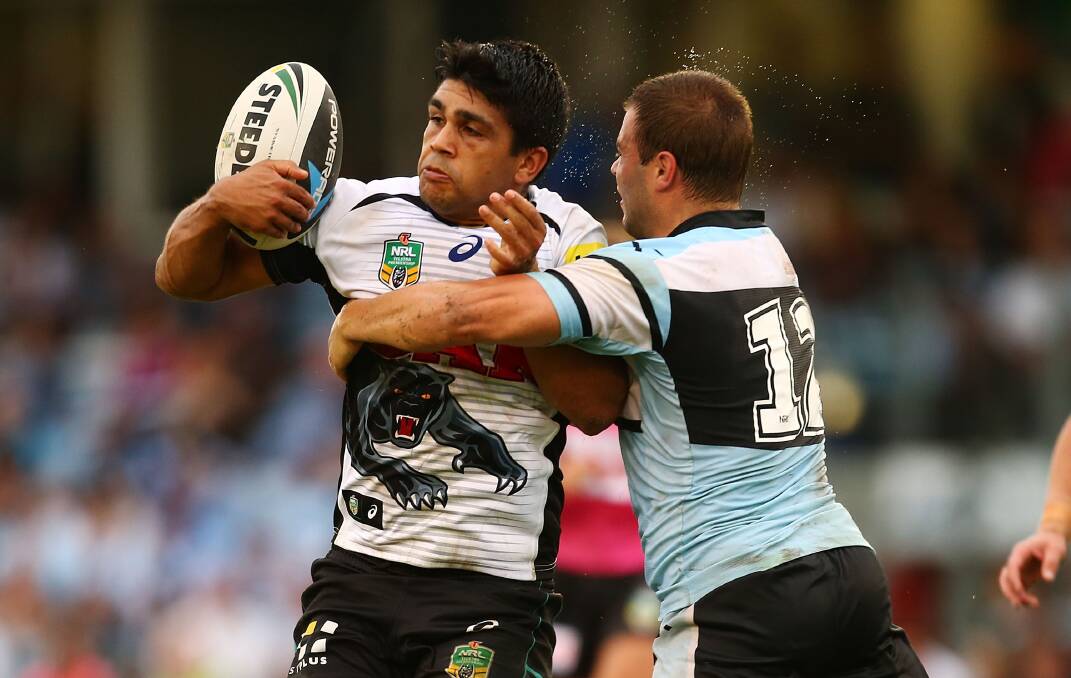 SYDNEY, AUSTRALIA - APRIL 26: Tyrone Peachey of the Panthers is tackled during the round 8 NRL match between the Cronulla-Sutherland Sharks and the Penrith Panthers at Remondis Stadium on April 26, 2014 in Sydney, Australia. (Photo by Mark Nolan/Getty Images)