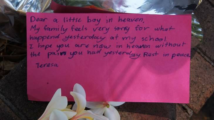 Flowers outside Carlingford Public School, where a six-year-old boy was killed on Wednesday.