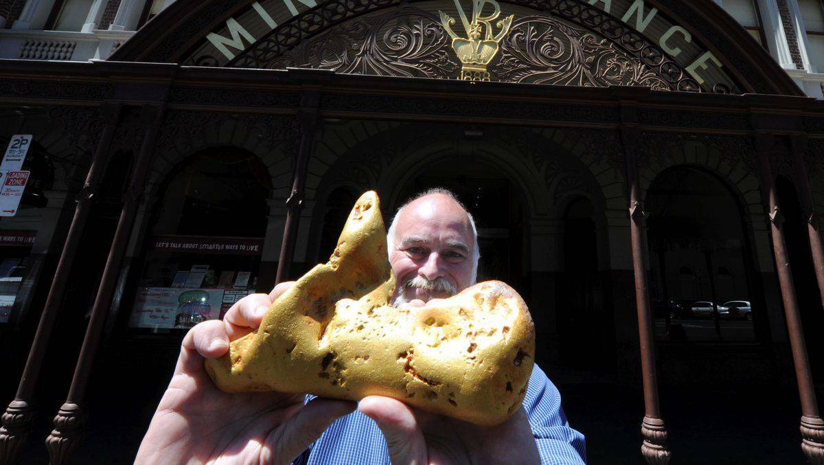 Gold Shop owner Cordell Kent with a replica of the now sold nugget. Photo: JEREMY BANNISTER